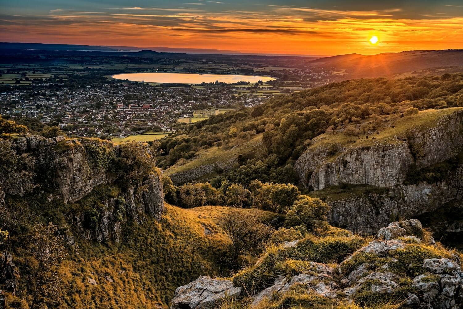 Sunset over Cheddar Gorge and the reservoir on the Mendip Hills