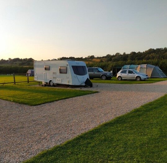 A caravan on an all-weather gravel hardstanding pitch